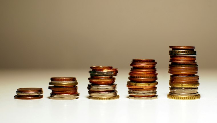 Five stacks of coins rising from left to right