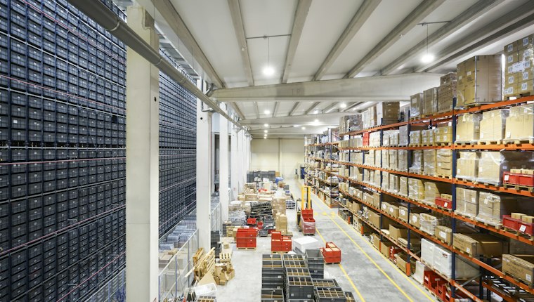 A large warehouse with racks and pallets